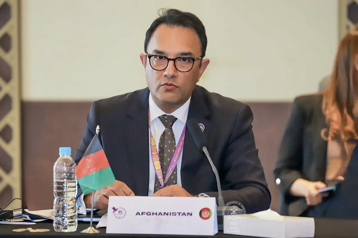 Afghan delegate at table